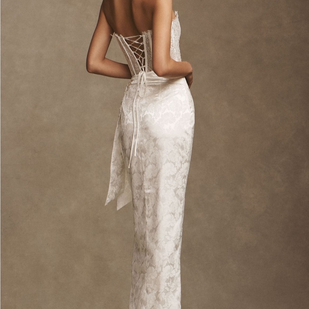 V. Chapman Jeanine corseted strapless wrap gown with jacquard skirt.